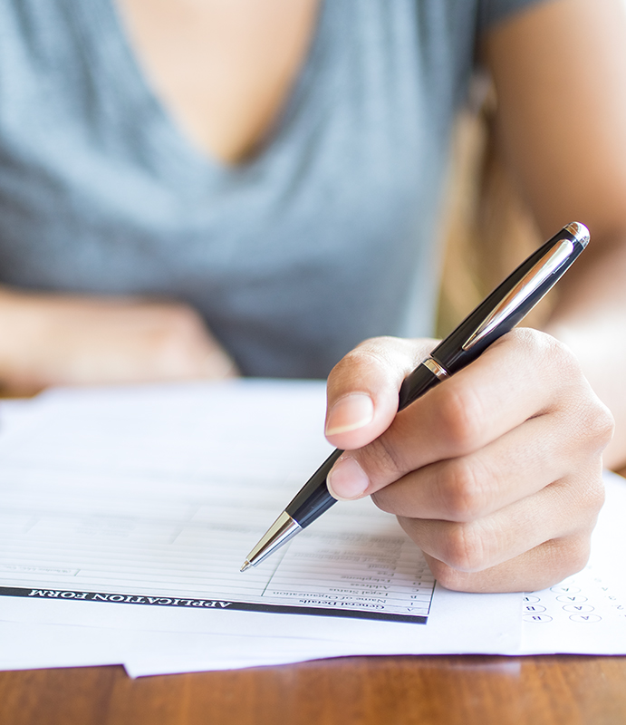 close-up-woman-filling-application-form